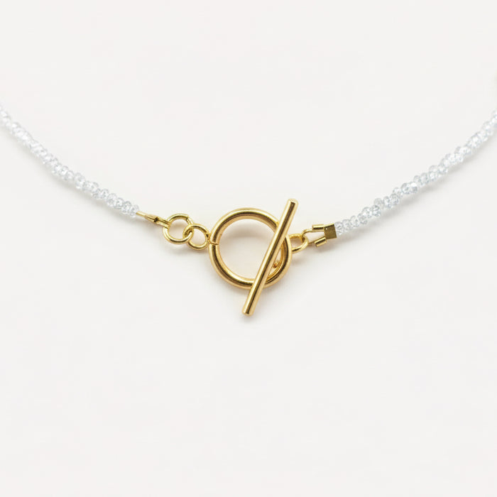 Collier doré Iris-perles de verre facettées et fermoir en T